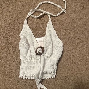 White ring top. Ties around the neck